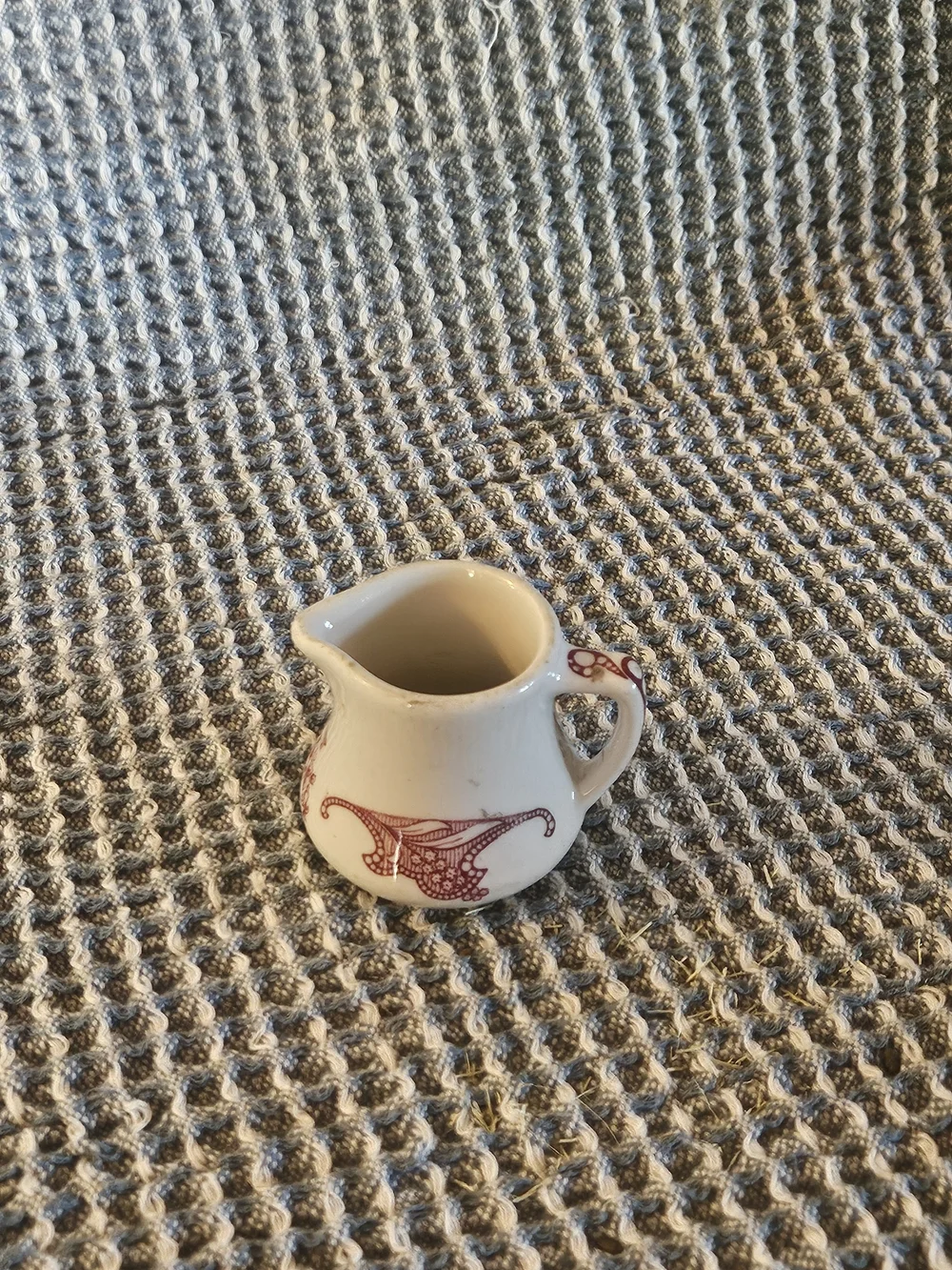 Cream Ceramic Mini Pitcher with Red Filigree Accent